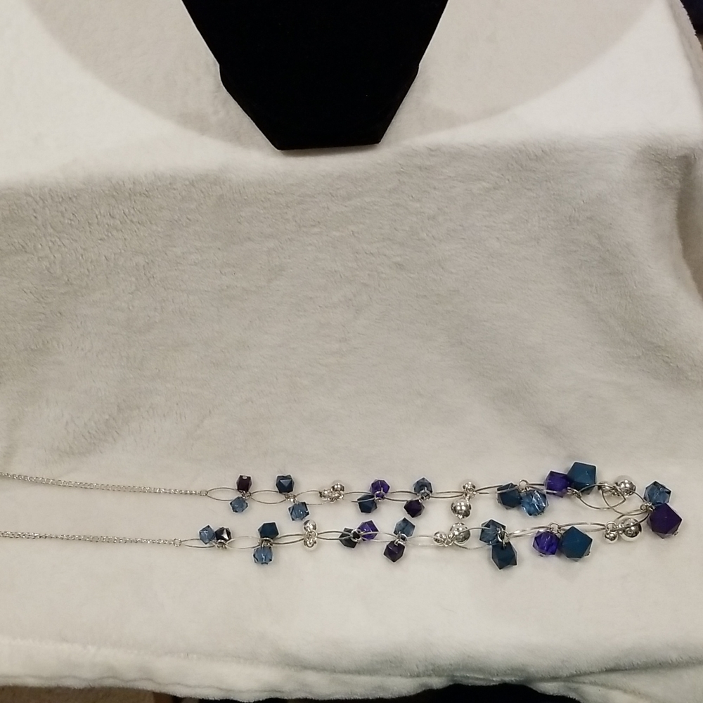 36 inch silver necklace.  With blue and purple beads with sliver loops